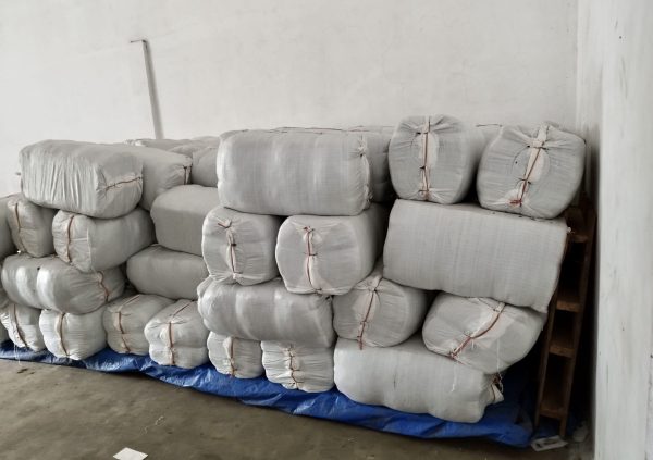 After redrying and sorting, it will be packed with a pressing machine at 50 kg per bale to export. (Photo courtesy of Boedi Julianto)