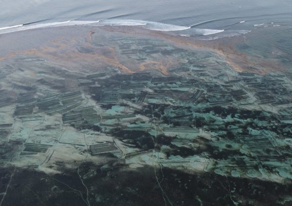 In East Indonesia, outer reefs serve as natural protection to seaweed farms located on the shallower inner reef section. Nemberala, NTT, Indonesia
