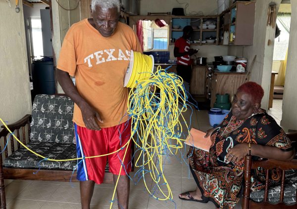 St Vincent: Farmers prepare synthetic ropes at home, cutting and bundling lengths for culture line construction.