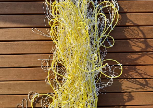 Brazil: Pre-looped polypropylene lines in yellow and white, prepared for quick seaweed attachment in Brazilian farm operations.