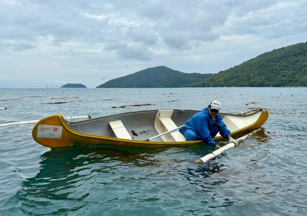 Brazil: A farmer in Rio adjusts cultivation lines, ensuring seaweed stays submerged and evenly spaced during daily maintenance rounds.